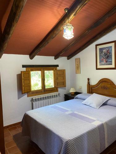 a bedroom with a large bed in a room at La Toba in Burunchel