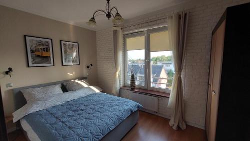 Posteľ alebo postele v izbe v ubytovaní apartament AWA Bajkowe Kołobrzeg