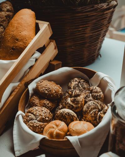 a box of donuts and a basket of bread at Myrtis Spa Hotel in Plakias
