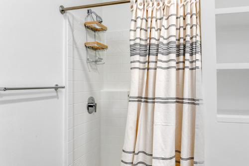 a shower with a shower curtain in a bathroom at Allston Studio w WD Gym nr Green Line BOS-672 in Boston