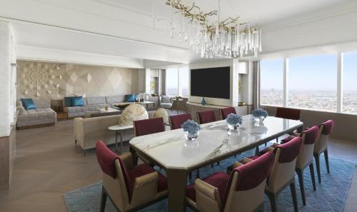 a dining room with a table and chairs at Four Seasons Hotel Riyadh in Riyadh