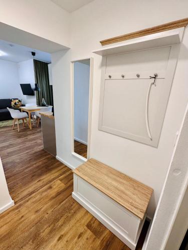 a living room with a bench on the wall at Pension Alabama in Warnemünde