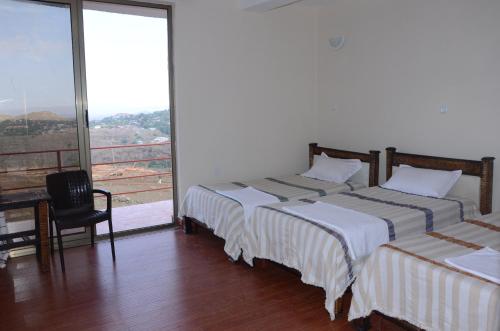 Un ou plusieurs lits dans un hébergement de l'établissement Zan-Seyoum Hotel - Lalibela