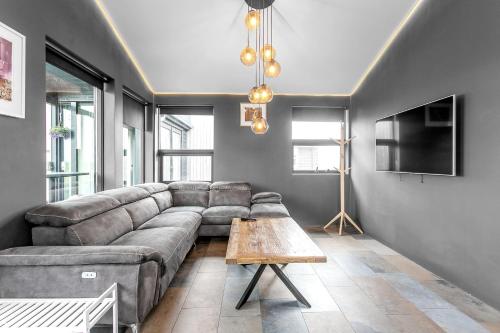 a living room with a couch and a table at Selfoss Modern Cabins in Selfoss