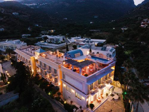 an aerial view of a building with lights on at Porto Plakias & Spa in Plakias