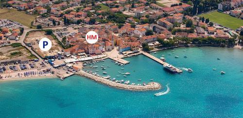 an aerial view of a harbor with boats in the water at Hotel Marina in Fažana