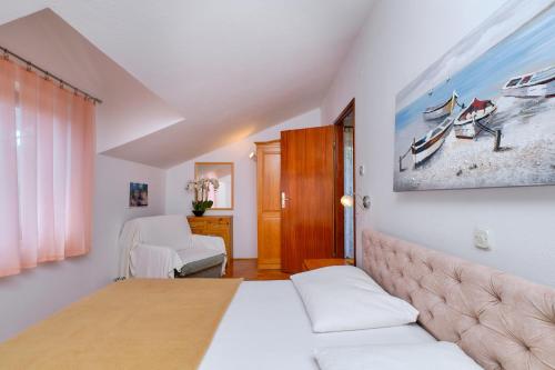 Postel nebo postele na pokoji v ubytování Apartments Marija