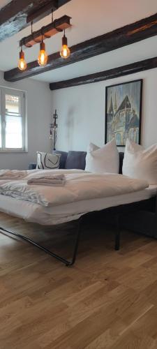 a large bed in the middle of a room at Ferienhaus Harztörchen in Halberstadt
