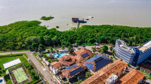 an aerial view of a resort with a swimming pool at Hotel Solar in Salinópolis