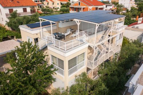 an aerial view of a house with a solar roof at SunAdria Apartments in Kožino