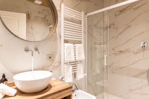 a bathroom with a sink and a shower at TENUTA FOGLIANI Resort & Natural Spa in Visciano