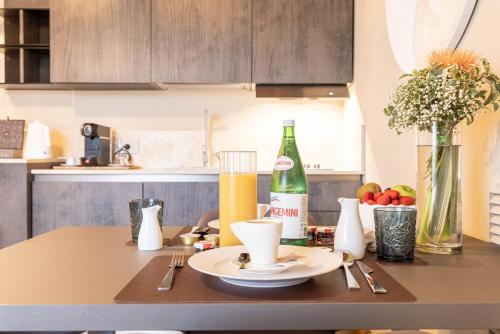 a kitchen counter with a table with a bottle of wine at TENUTA FOGLIANI Resort & Natural Spa in Visciano