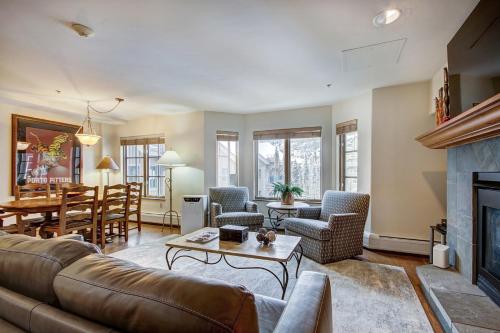 a living room with a couch and a fireplace at 1BR Plus Den, Heart of Beaver Creek Village in Beaver Creek