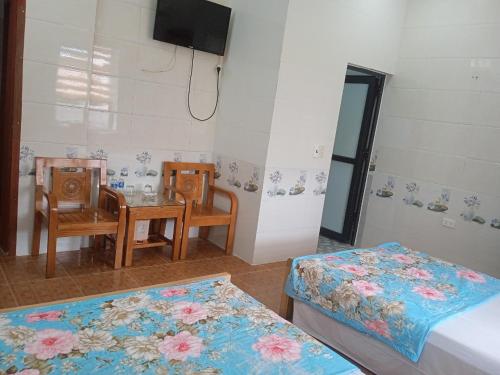 Ein Bett oder Betten in einem Zimmer der Unterkunft Hotel Thanh Bình 2