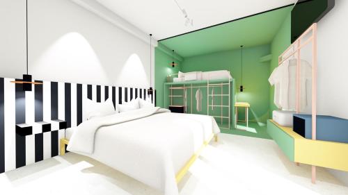 1 dormitorio con cama blanca y pared verde en Hotel Graziella, en Bellaria-Igea Marina