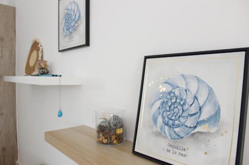 a picture in a frame on a shelf with a picture at Amar'e Aparthotel & Spa in Las Terrenas