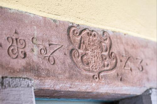 a close up of a stone with a heart on it at Chez l'Alsacien - Gîte authentique de charme classé 4 étoiles in Barr