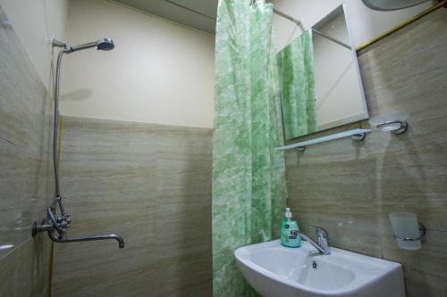 a bathroom with a sink and a shower at house by the river in Mestia
