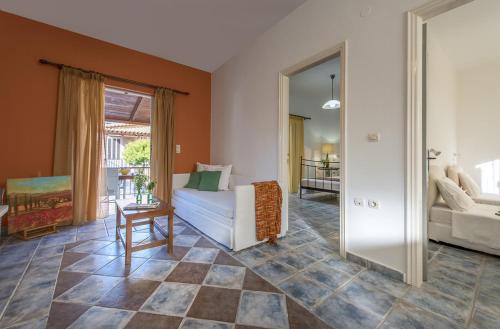 a living room with a couch and a table at Lofos Soilis in Tragaki
