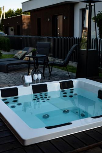 a ping pong table sitting on a patio at Lazy House Klaipeda in Klaipėda