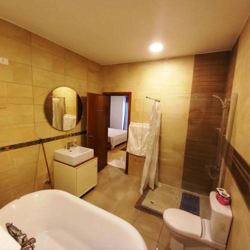 a bathroom with a sink and a toilet and a shower at Ali Luxury Villa in Luxor