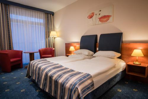 Letto o letti in una camera di SkyHotelGwarna