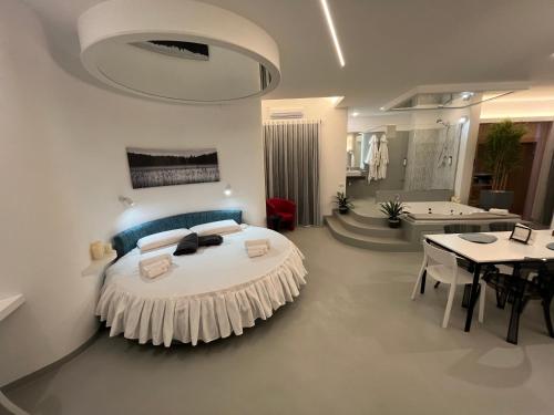 a bedroom with a large bed and a bathroom at La Casba in Paola