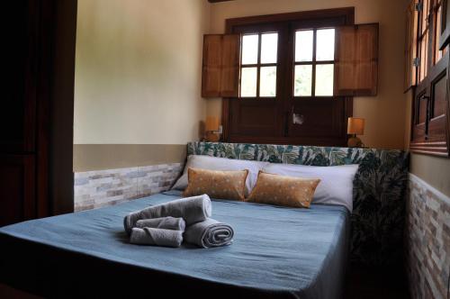 a bed with two towels on it in a room at Oasis Hill Icod de los Vinos in Icod de los Vinos