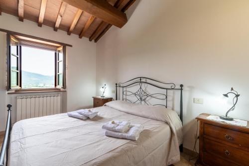 Llit o llits en una habitació de Pugnano Alto -appartamento Castagna