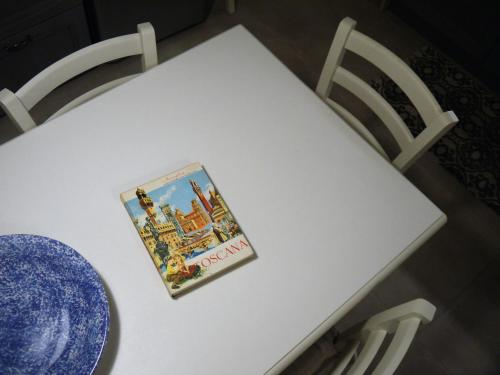 a book sitting on top of a white table at Casa Marzia in Montevarchi