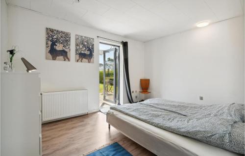 a white bedroom with a bed and a window at Stunning Home In Haderslev With Wifi in Haderslev