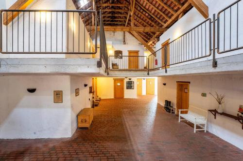 an empty room with a staircase in a building at Grashaus Upleward in Krummhörn