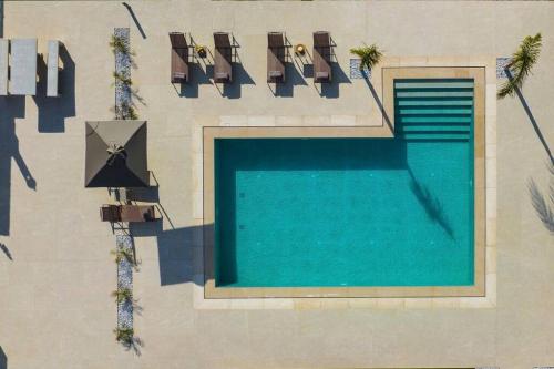Изглед към басейн в Kayy Apartments 1 in Matala или наблизо
