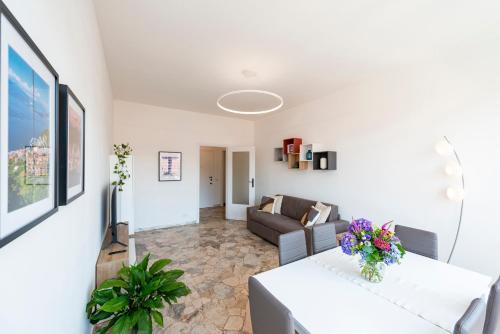 a living room with a couch and a table at Labiena Lake Maggiore in Laveno