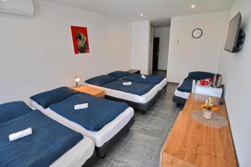 A bed or beds in a room at Penzión Šírava