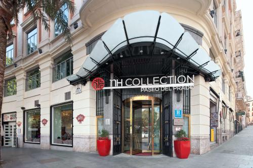a store front of a building with a sign on it at NH Collection Madrid Paseo del Prado in Madrid