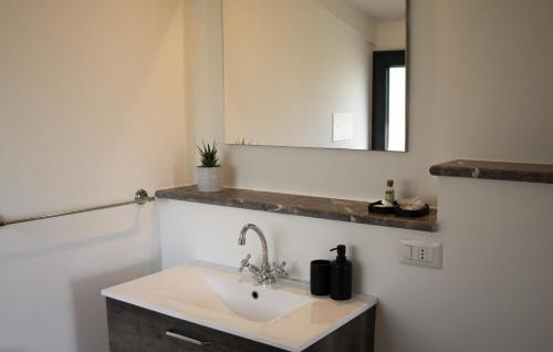 a bathroom with a sink and a mirror at Locanda Le Tre Sorelle in Casal Velino