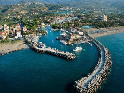 an aerial view of a harbor with boats in the water at Portorosa in Torre Forte