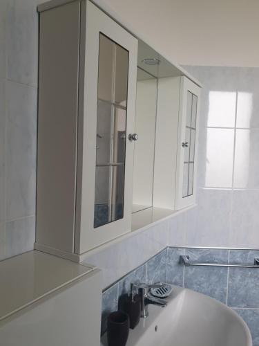a bathroom with a sink and a mirror at Oasi del benessere in Ilbono