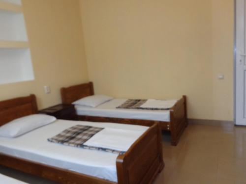 Кровать или кровати в номере White Guest House