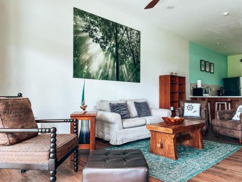 a living room with a couch and a table at El Sitio Village in Playa Venao