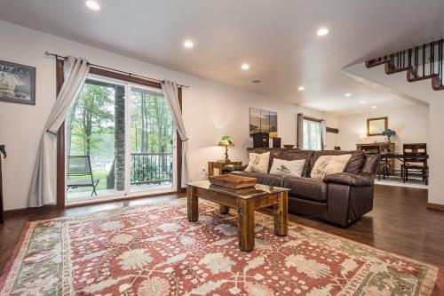 a living room with a couch and a table at Bear Trap in Swanton