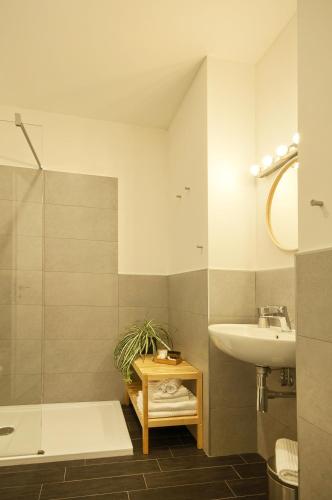 a bathroom with a sink and a bath tub and a sink at Relais Quattro Fontane in Rome