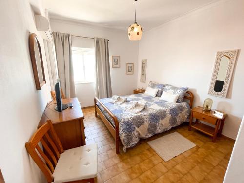 Postel nebo postele na pokoji v ubytování Apartamento T1, Praia da Rocha - Edificio Mar Azul