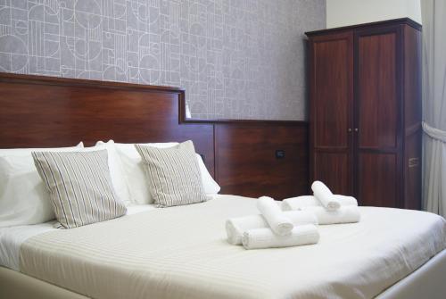 Postel nebo postele na pokoji v ubytování Monti 66 Hotel