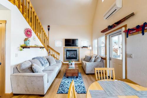 a living room with a couch and a table at Dover Hideaway in Dover
