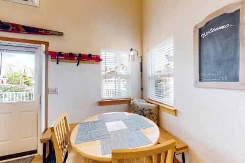a classroom with a table and chairs and a chalkboard at Dover Hideaway in Dover