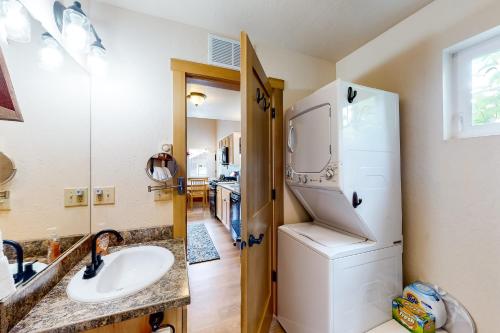 a bathroom with a sink and a refrigerator at Dover Hideaway in Dover