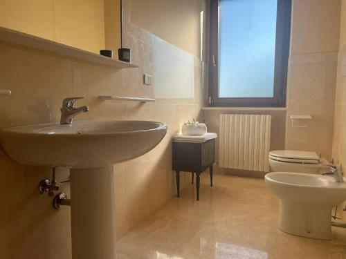 a bathroom with a sink and a toilet at VALLELY la collina sul mare B&B d'Abruzzo in Francavilla al Mare