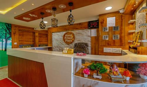 a counter in a restaurant with wood paneling at Treebo Prince Plaza in Ahmedabad